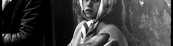 Stojan Kerbler, A girl with bread, 1970 BW photograph